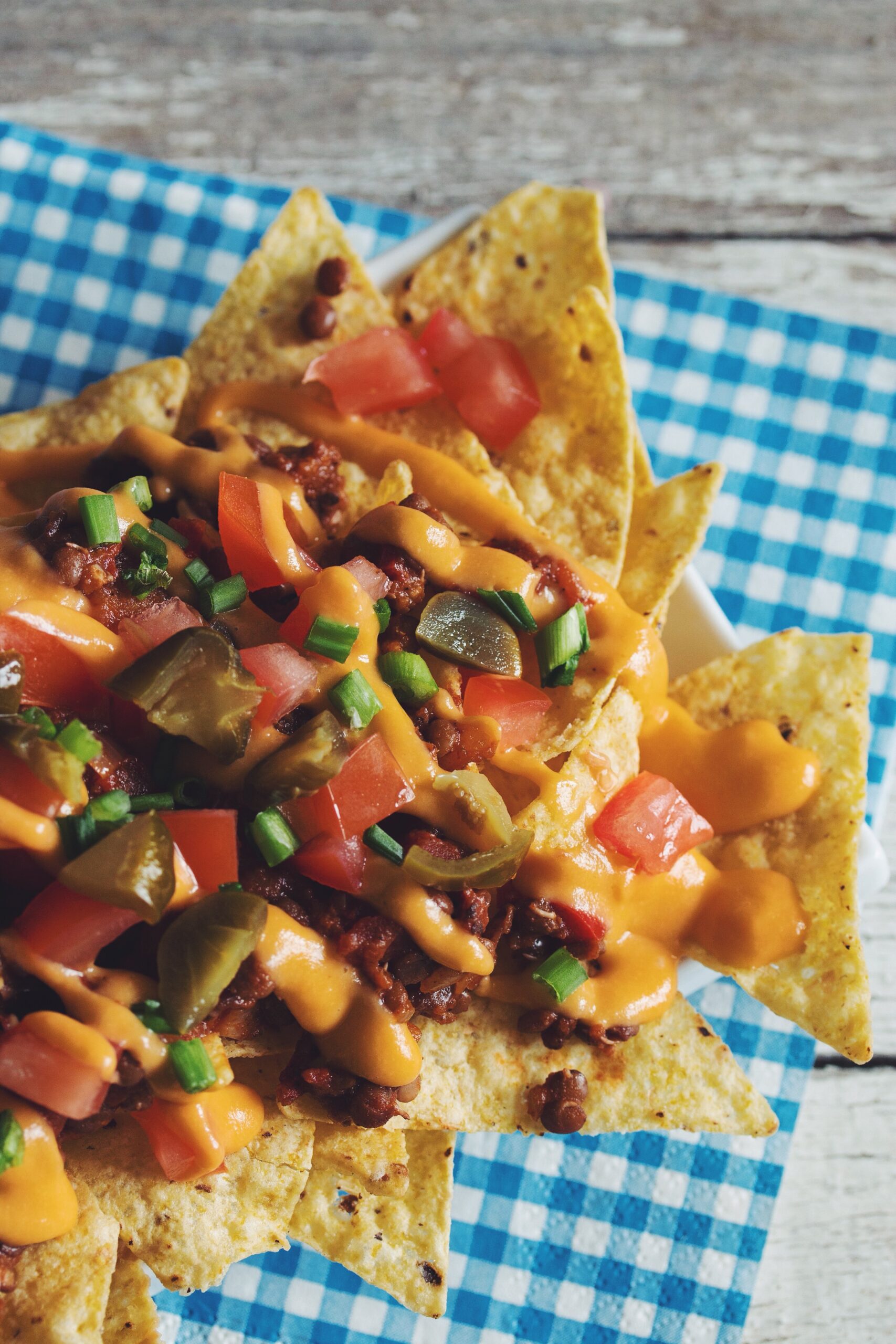 overhead of lentil chili cheese nachos