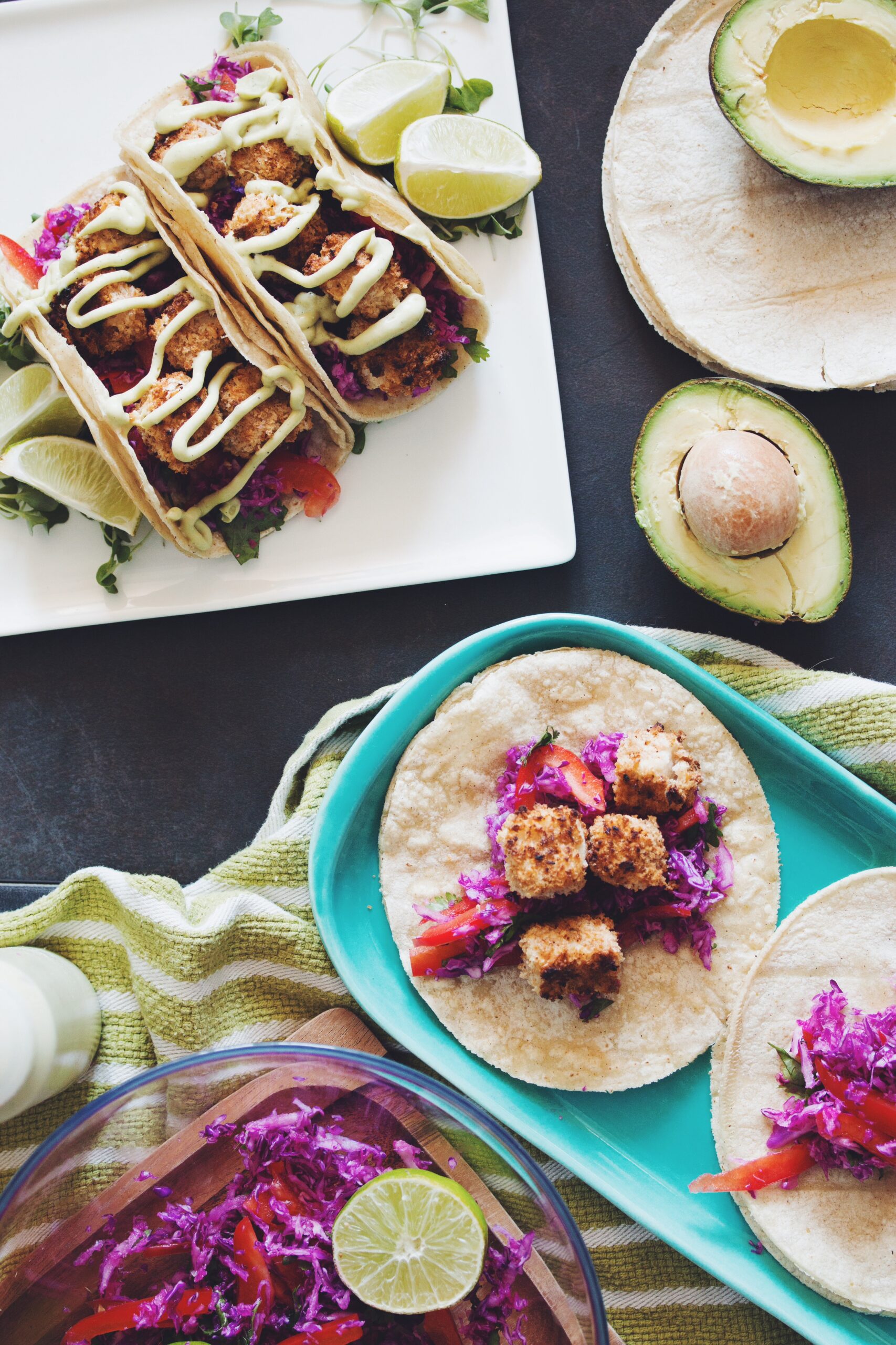 overhead of plates of with crispy coconut tofu tacos
