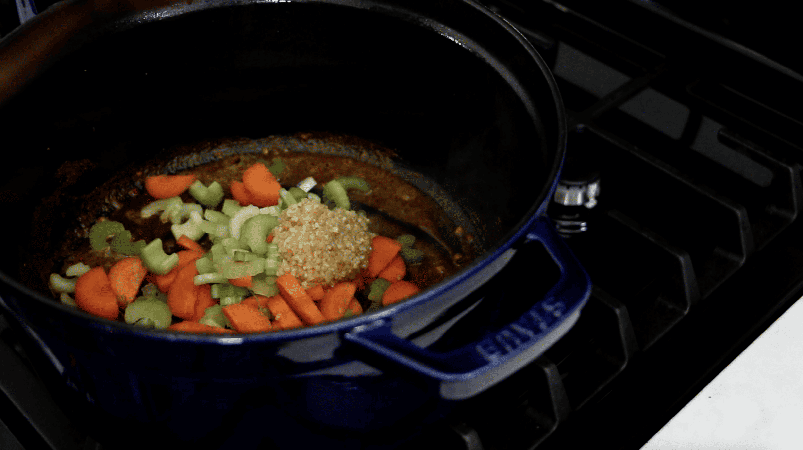 celery, carrot and garlic in a pot