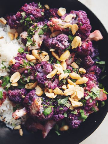roasted purple cauliflower with rice in a bowl