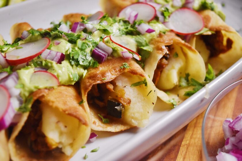 jackfruit and potato flautas with avocado sauce
